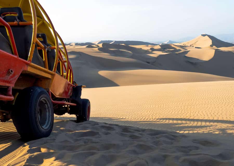 From Huacachina: Sandboarding and Dune Buggy Tour + Income - The large dune, sunset, and Huacachina photo
