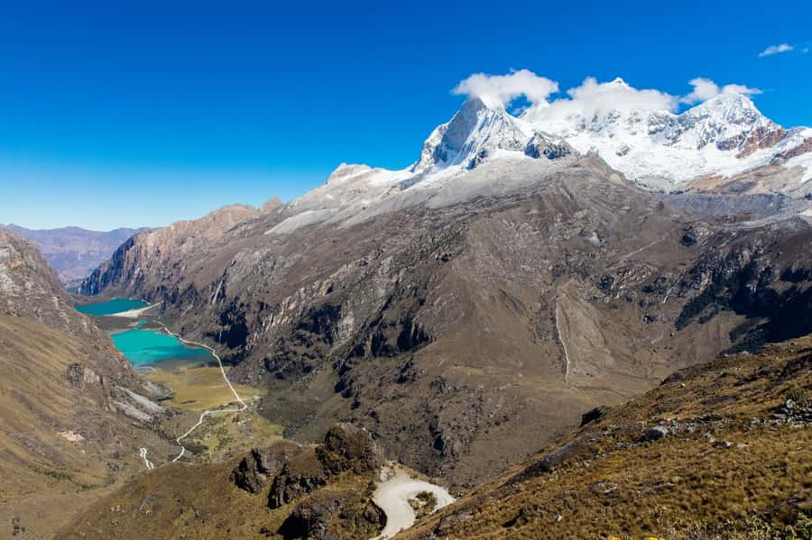 From Huaraz: Lake 69 Trek Day Tour - White Mountain Range - Reaching the turquoise water of Lake 69