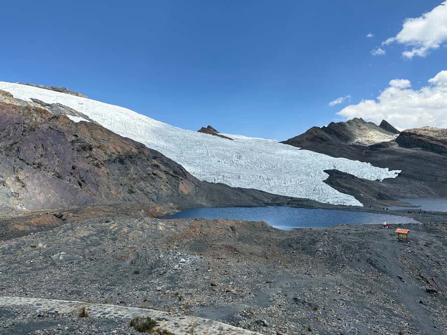 From Huaraz: Tour to the Pastoruri Glacier and Puya Raimondi - Mountain views and cave scenery at Parco and San Patricio