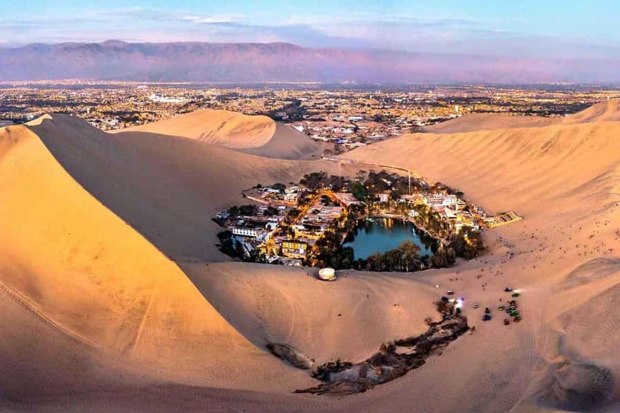 From Lima: Ballestas Islands, Huacachina and Wine Route Trip - Paracas pier and the Ballestas Islands boat trip