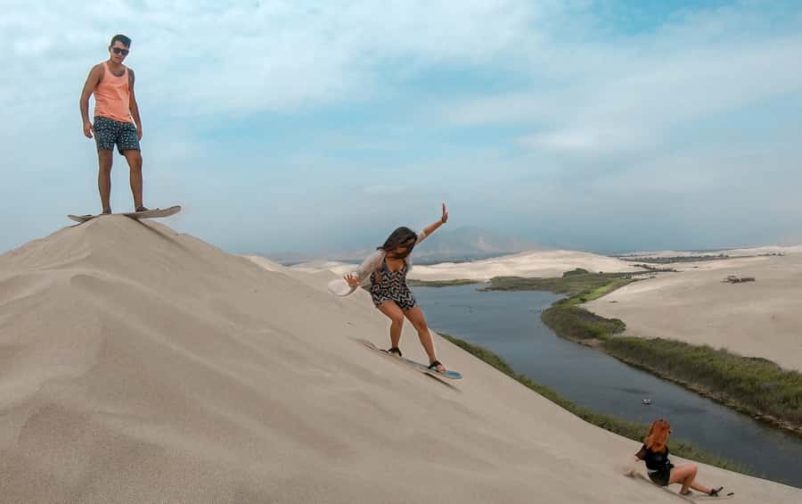 From Paracas: Mini Buggy Tour & Sandboarding at Oasis - Languages, pickup, and practical planning