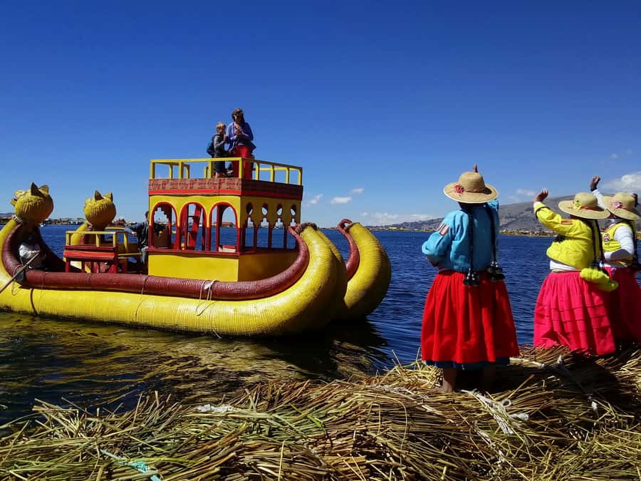 From Puno: Floating Islands of the Uros Half-Day Tour - The reed boat ride and the extra cost