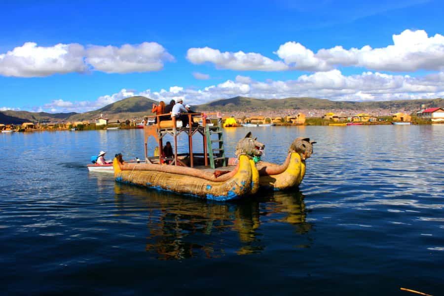 From Puno: Uros floating islands half Day tour - Arriving on an island built from roots