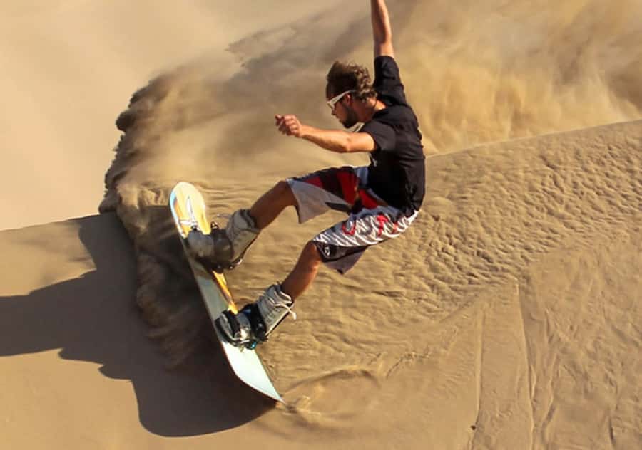 Pro Sanboarding or skiing in Huacachina from Lima - Day trip - Sandboarding down the Ica dunes