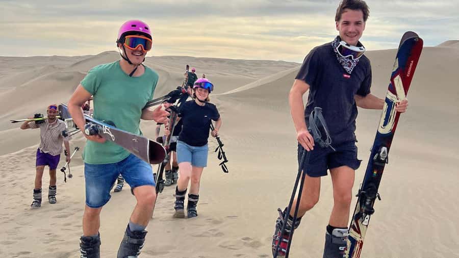 Pro Sanboarding or skiing in Huacachina from Lima - Day trip - Sunset over the oasis and dunes