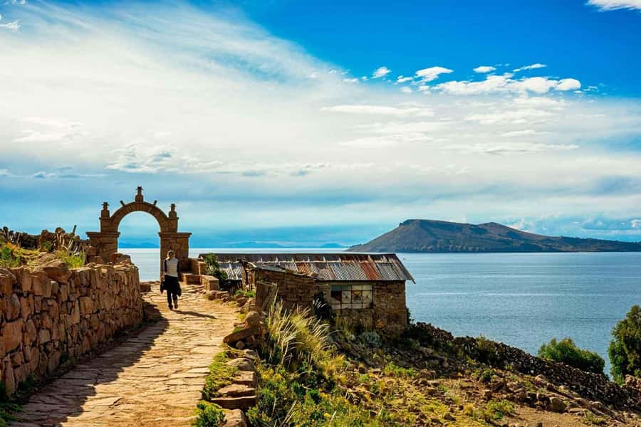 Puno: Uros and Taquile Islands Full-Day Tour with Lunch - Walking on the Uros floating islands